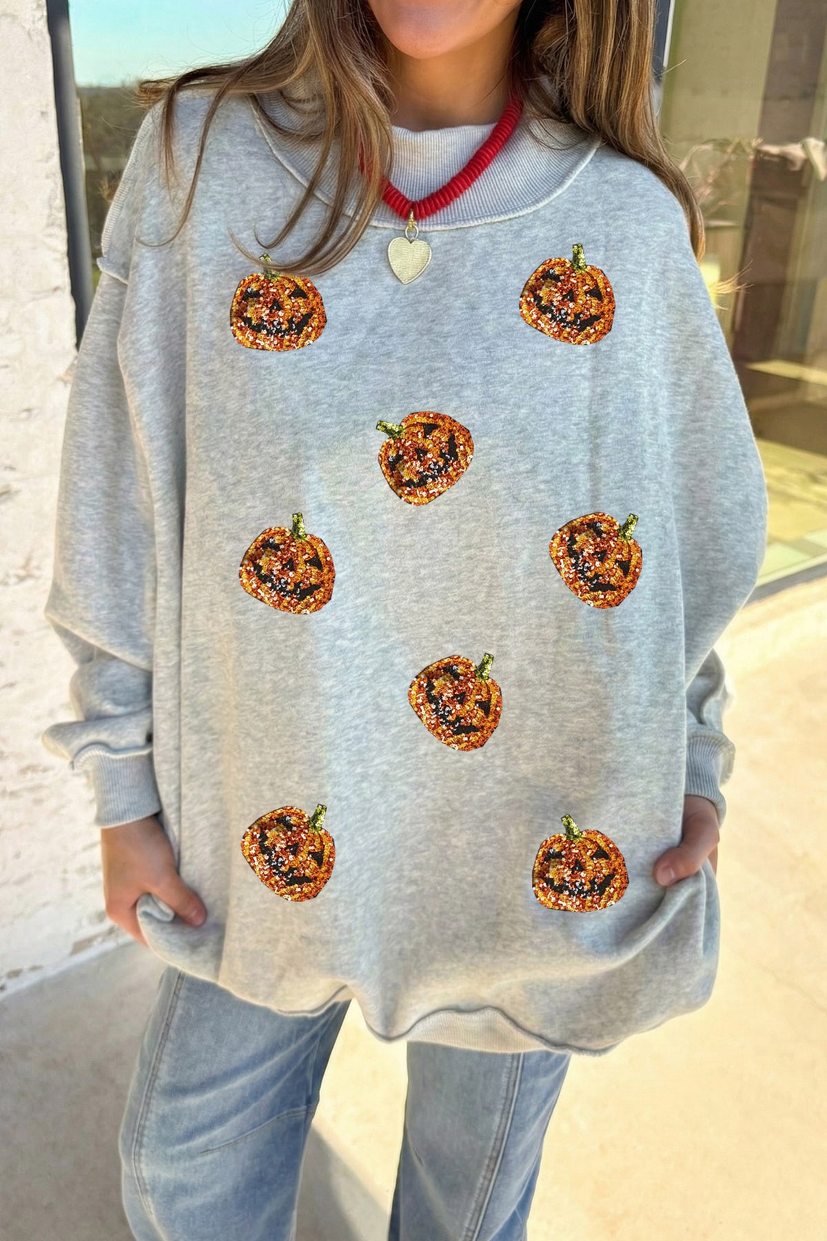 Light Grey Sequined Halloween Pumpkin Graphic Exposed Seam Mock Neck Sweatshirt